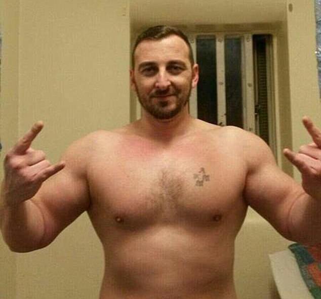 Hellbanianz member Tristan Asllani smirking as he poses for a picture from inside prison